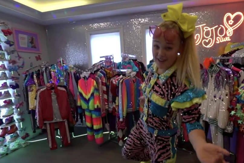 Jojo Siwa has two giant wardrobes: one is filled with stage costumes, the other is stocked with merchandise