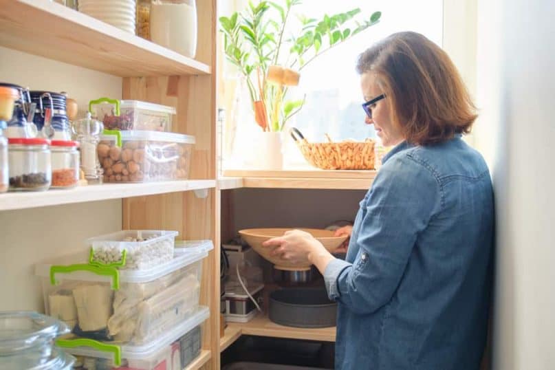 Store products in storage bins inside cabinets and pantries